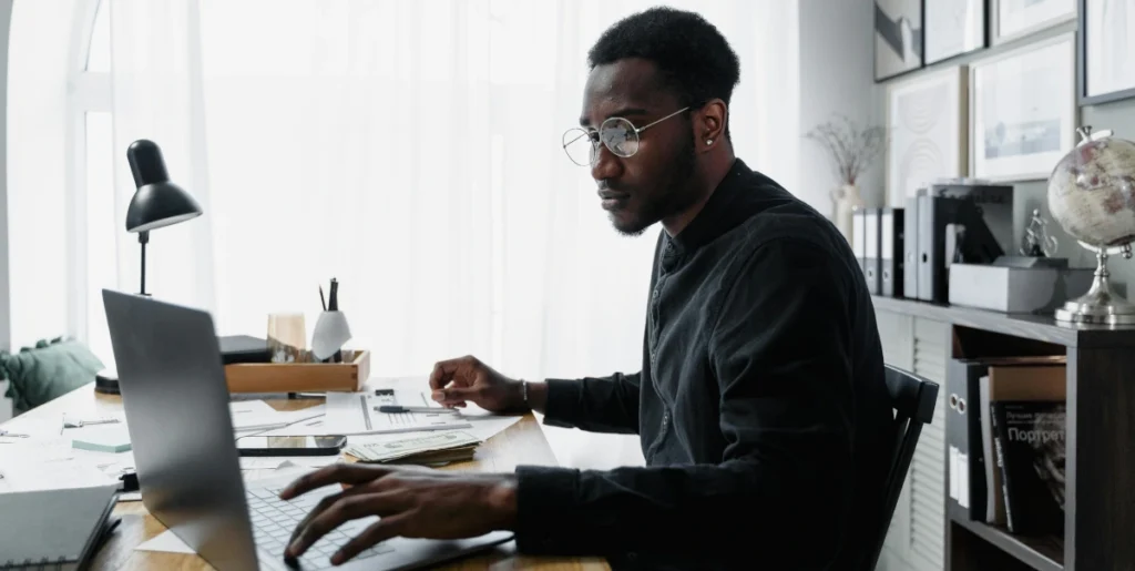 The current image has no alternative text. The file name is: black-man-at-office.webp